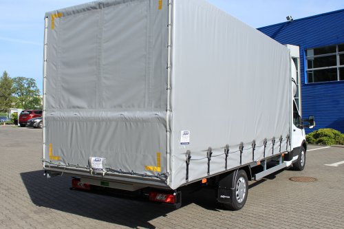 AG Zabudowy - Realizacje - Ford Transit - międzynarodówka z kabiną tylną, obustronną firanką i sprężynowym systemem zwijania plandeki z tyłu